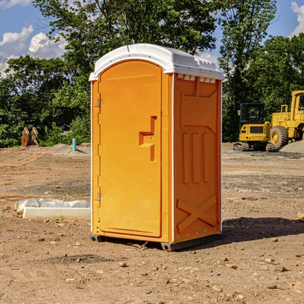 how often are the portable toilets cleaned and serviced during a rental period in Champaign City